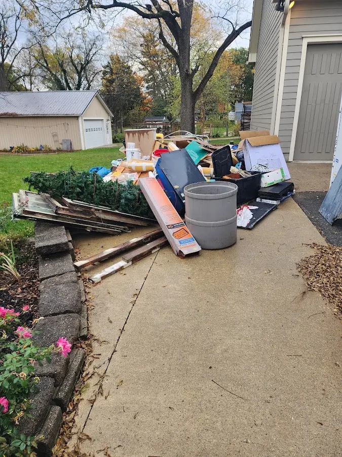 Dumpster being loaded with debris for 30 Yard Dumpster Rental in East Point